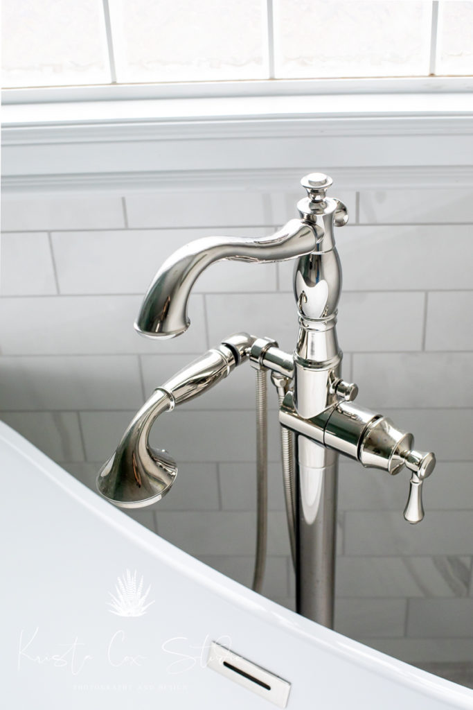 Close up photo of beautiful chrome tub faucet.